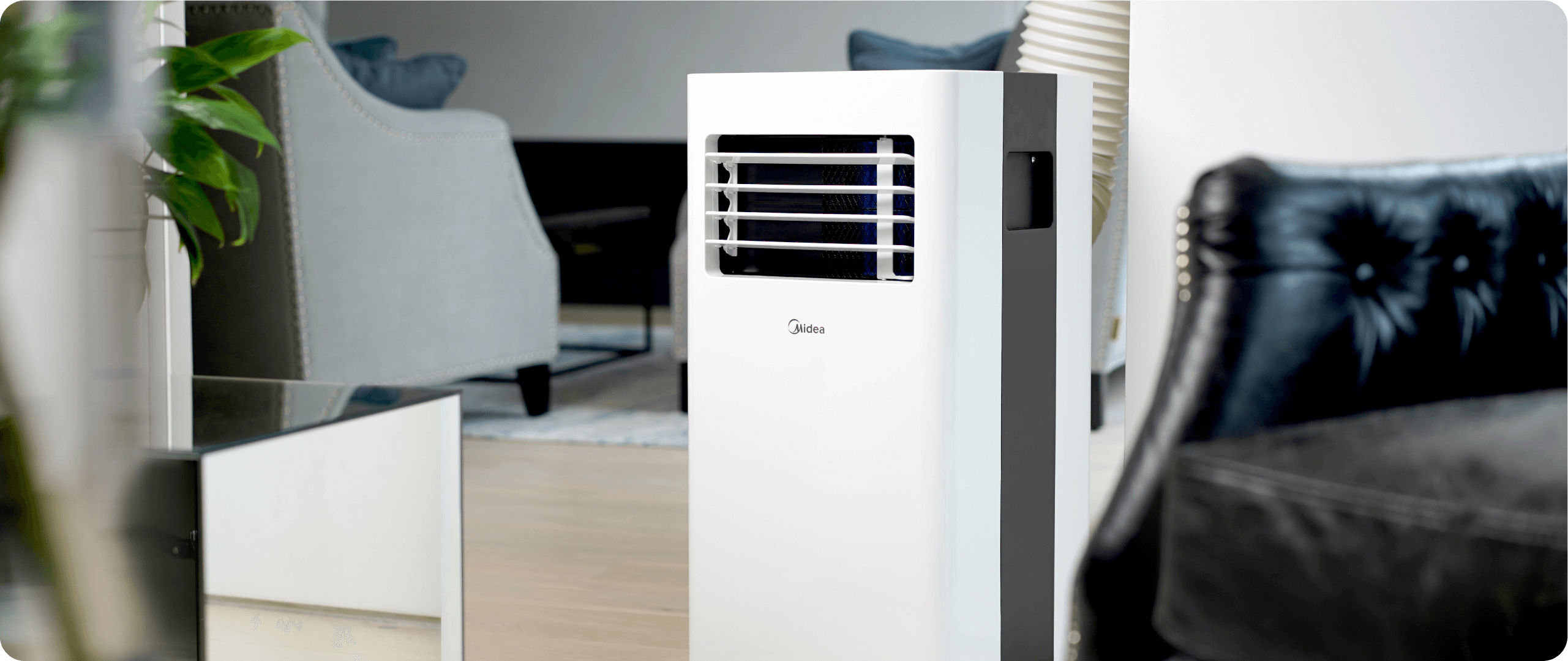Black and white air conditioner in the centre of the room