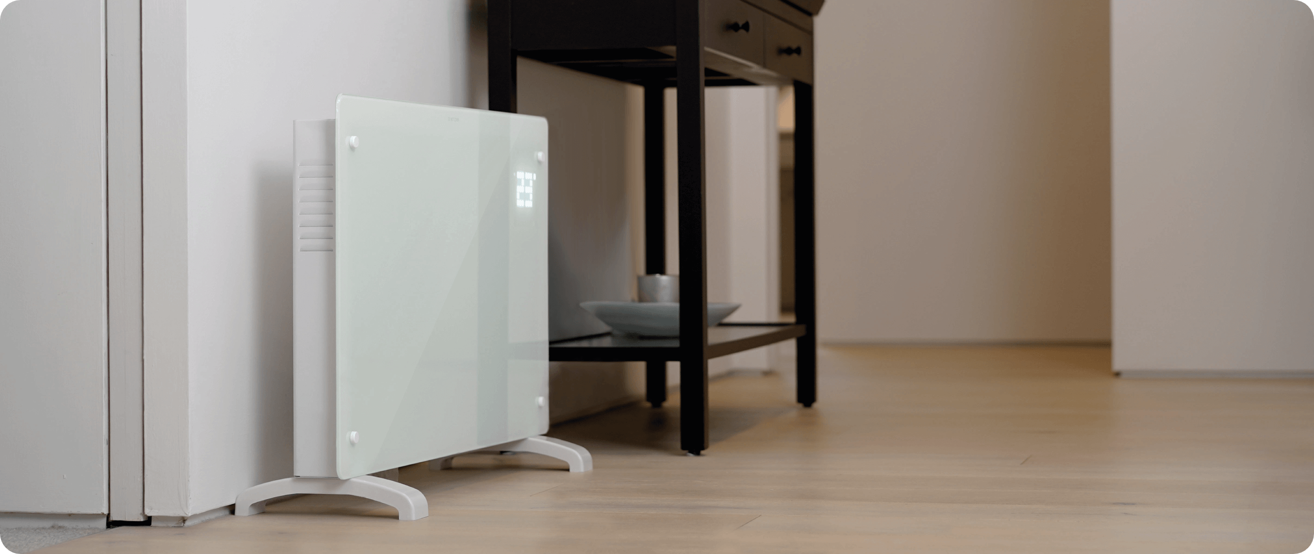 White portable heater against the wall 