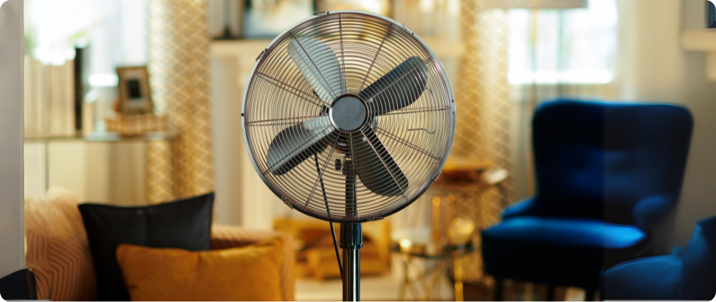 Black pedestal fan in the lounge